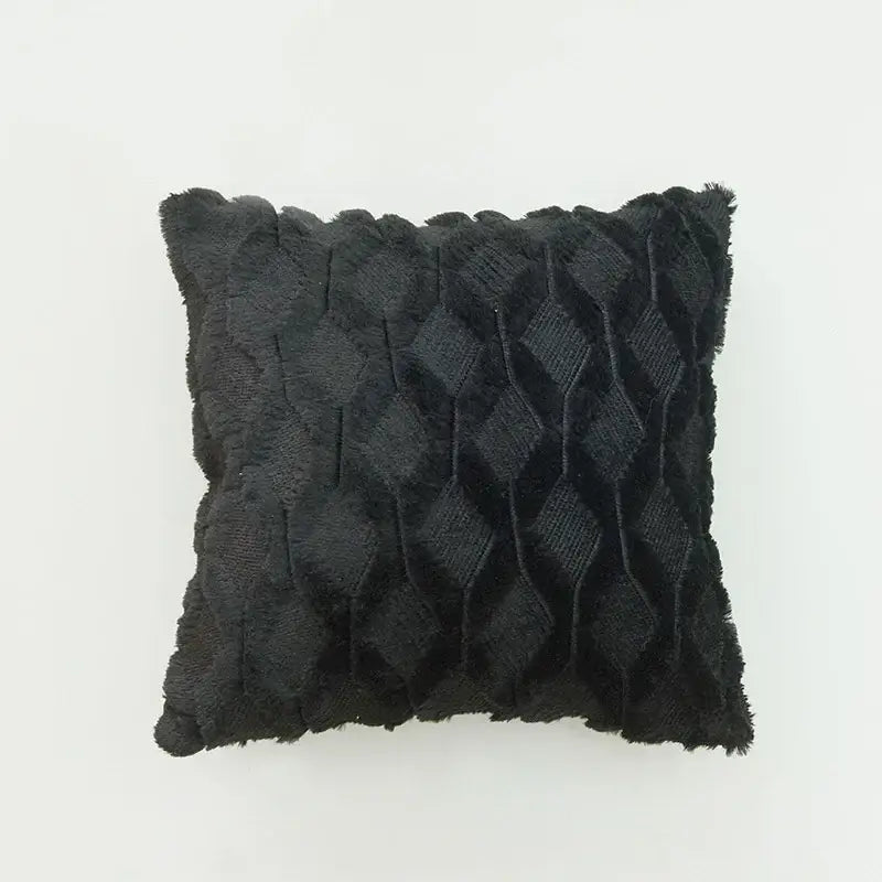 Black textured throw pillow with diamond-patterned weave and frayed edges as a stylish diamond cushion cover