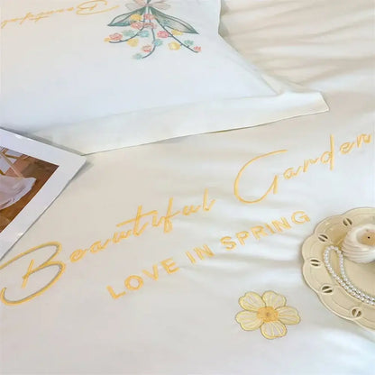 White satin bedding set with gold butterfly flowers embroidery and beautiful garden love in spring design from decorbites