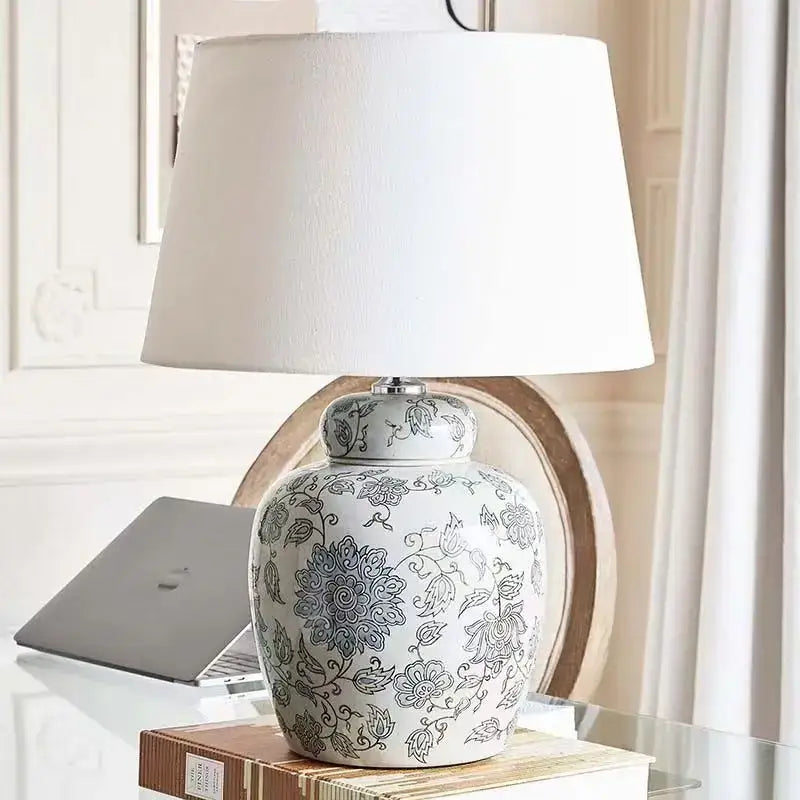 White floral ceramic desk lamp with intricate blue patterns and white fabric shade for bedroom side table decorbites ceramic desk lamp