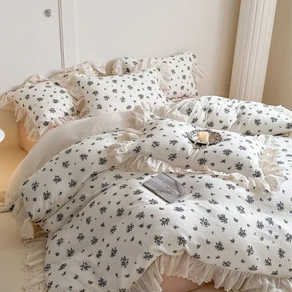 White floral cotton bedding set featuring delicate lace ruffles and ruffled edges for elegant bedroom decor
