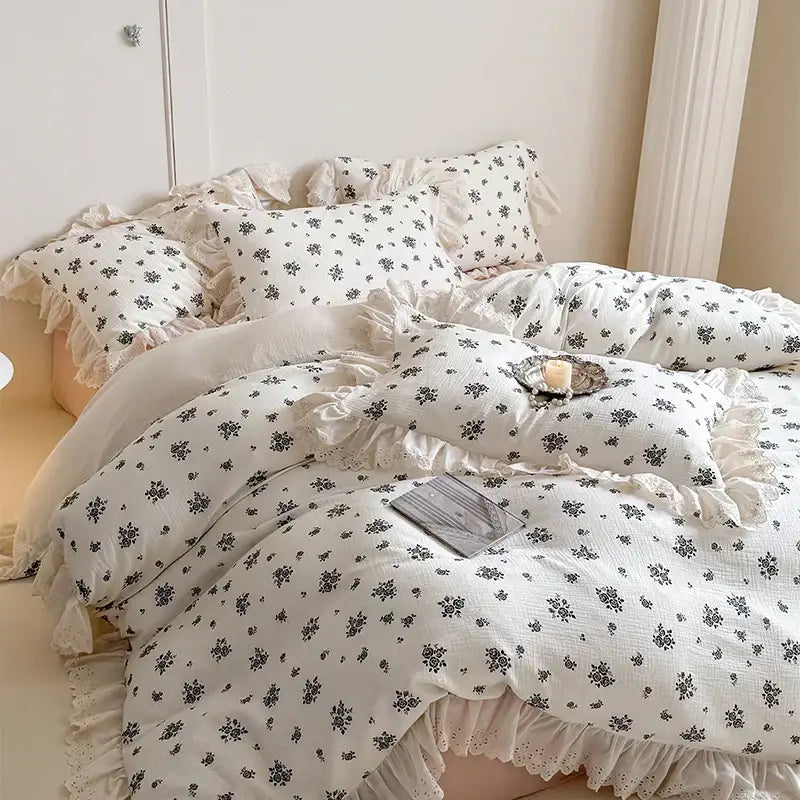 White floral cotton bedding set featuring delicate lace ruffles and ruffled edges for elegant bedroom decor