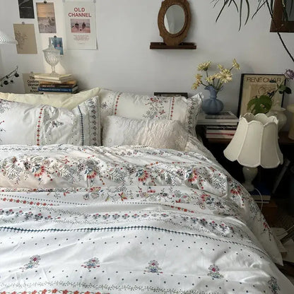 White floral embroidered cotton duvet cover set with delicate embroidery and subtle color accents for bedroom bedding