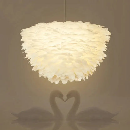 White floral pendant chandelier with off-white feather accents and a fluffy layered design for dining room use