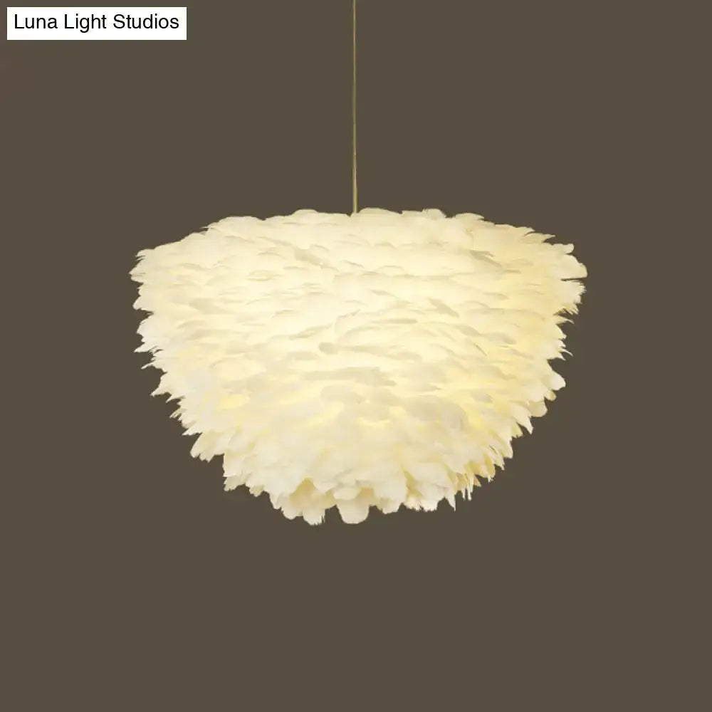 White floral pendant chandelier with off-white feather accents and a fluffy layered design for dining room use