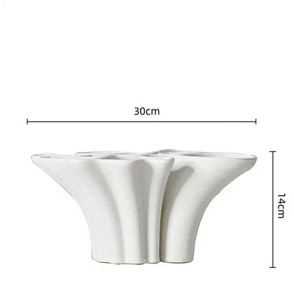 White geometric ceramic fold pattern flower shaped planter with fluted sides for decorbites geometric ceramic decor
