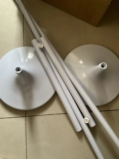 White glossy plastic butterfly chandelier stand with circular bases and cylindrical legs for dining room use