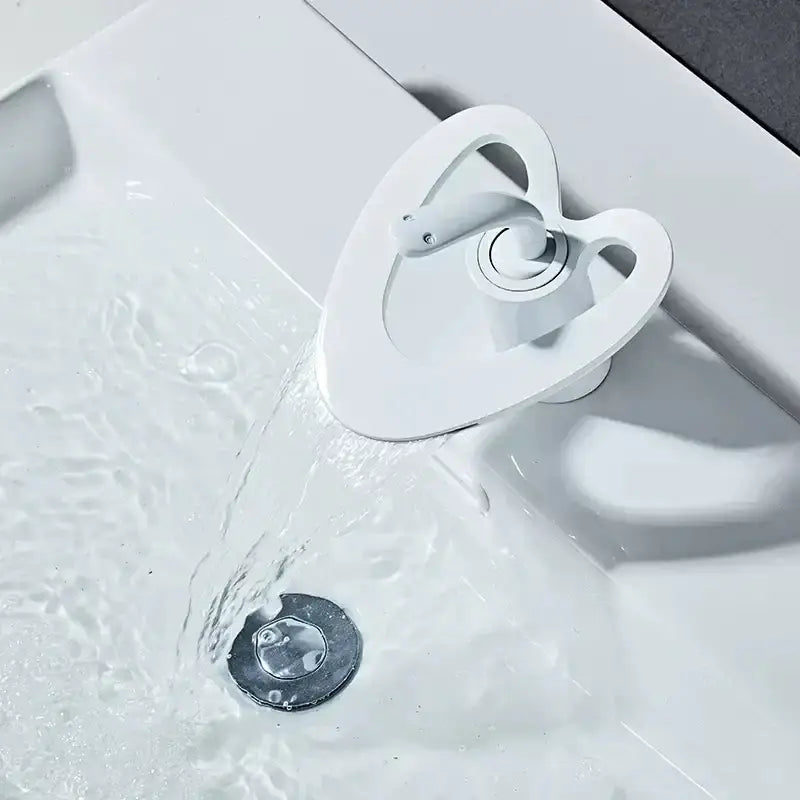 White heart-shaped basin faucet with gold accents in sleek modern design for bathroom decorbites golden white collection