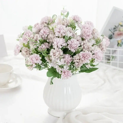 White hydrangea bouquet of light pink artificial flowers with green stems in a ribbed ceramic vase for living room decor