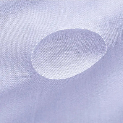 A soft lavender satin fabric with an oval cutout for the white and light blue decorbites cool feel summer quilt blanket