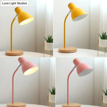 Yellow and pink macaron metal table light with wooden base and adjustable gooseneck for bedroom use
