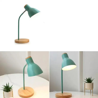 Teal macaron metal table light with wooden circular base and adjustable gooseneck arm for bedroom use