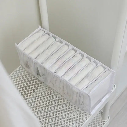 White mesh underwear organizer box set with ten clear compartments neatly holding folded white underwear for wardrobe storage