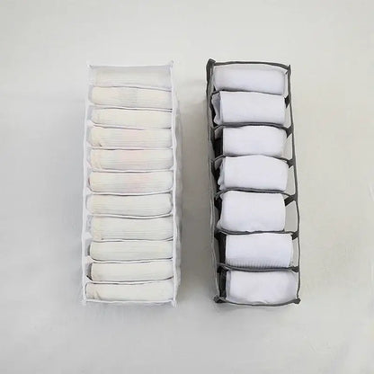 Two fabric drawer organizers white and gray holding folded white socks in a white mesh underwear organizer box set
