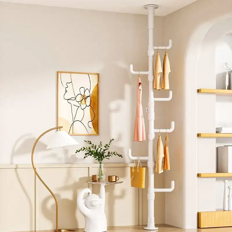 White plastic coat rack with multiple hooks and tiers holding garments and a yellow handbag for decorbites clothing storage hanging