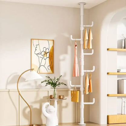 White plastic coat rack with multiple hooks and tiers holding garments and a yellow handbag for decorbites clothing storage hanging