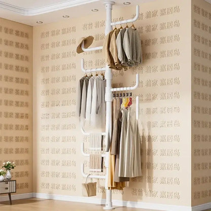 White multi tiered ladder clothing storage rack with multiple hanging bars and ladder-style shelf for coat rack use