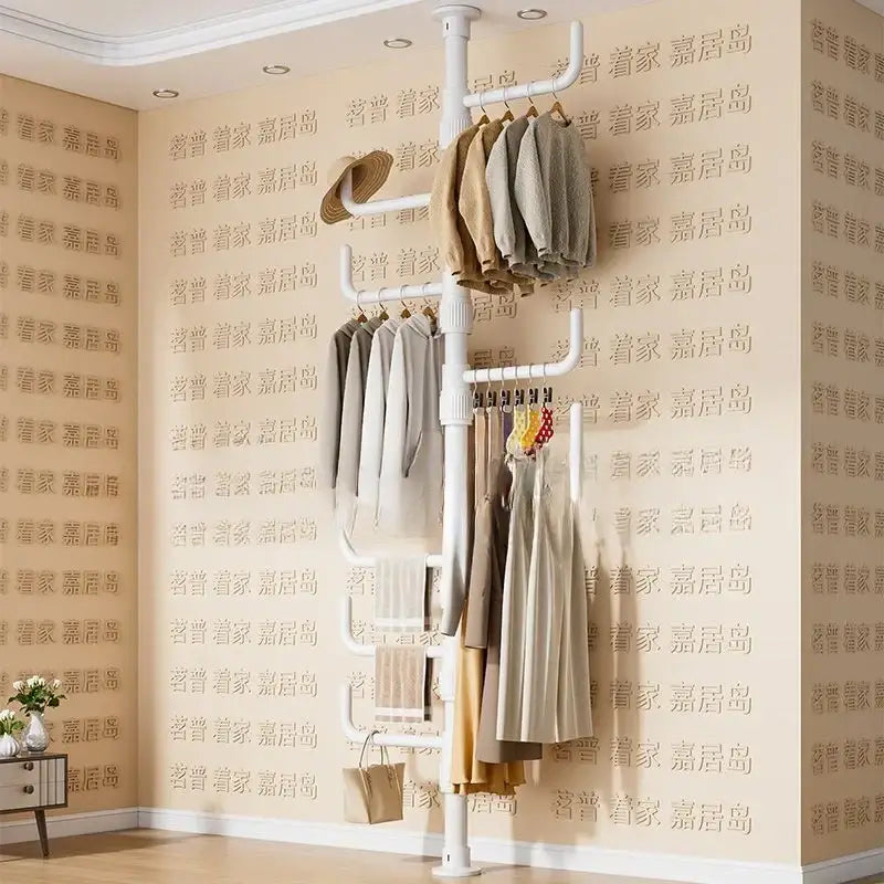 White multi tiered ladder clothing storage rack with multiple hanging bars and ladder-style shelf for coat rack use