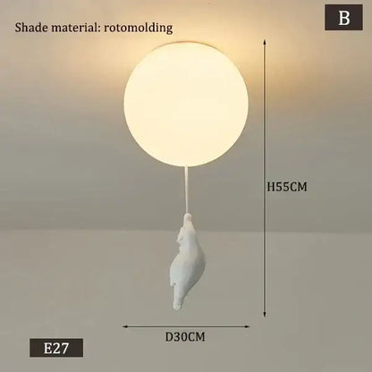 White rotomolded spherical pendant light with a dangling seashell-shaped cord pendant for kids bedroom polar bear theme
