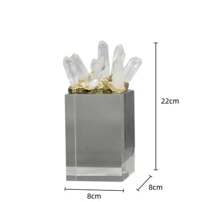 White quartz crystal stone marble ornament with clear quartz cluster and gold-toned base on acrylic pedestal