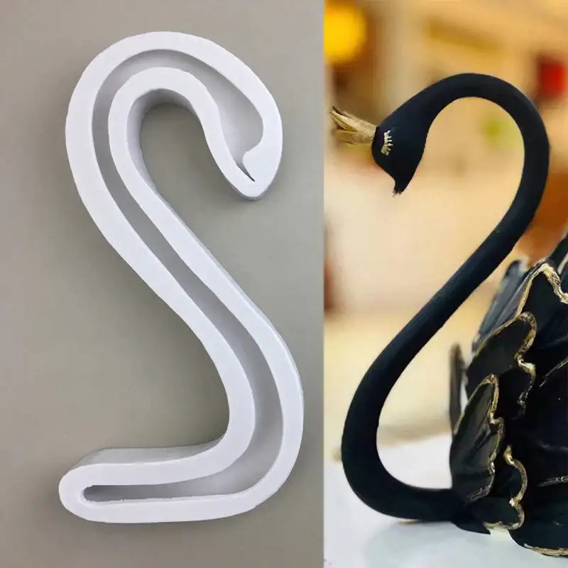 White and black swan figurines with gold accents using white silicone 3d wings cake mold and swan neck decorbites 3d wings
