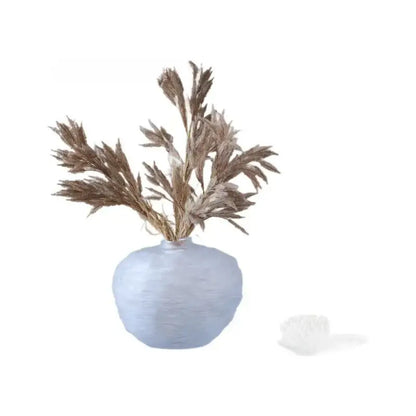 Light blue textured ceramic glass pleats vase with dried brown grass for living room flower decor