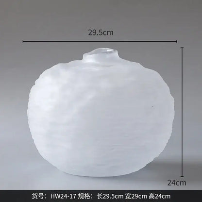 A frosted white glass pleats vase with a rounded textured surface for living room flower decor