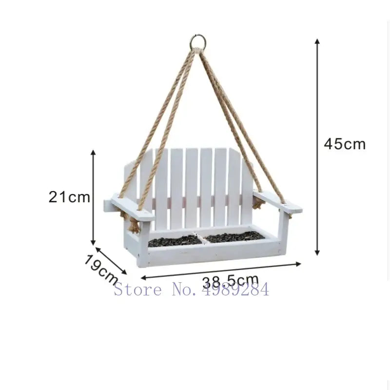 White wooden adirondack bird feeder chair with rope suspension and slatted design for garden decor