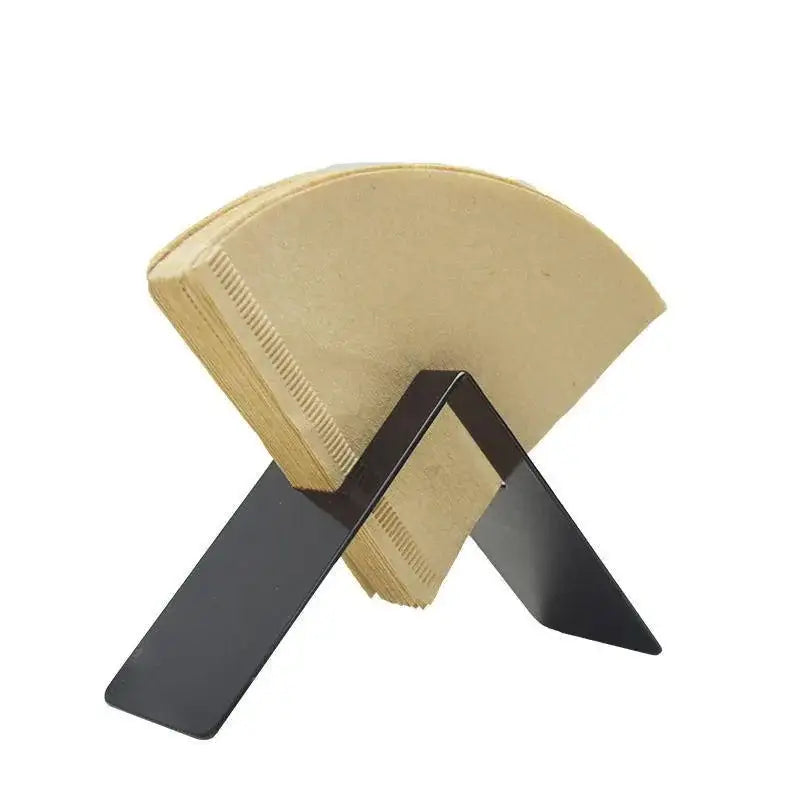 Black metal coffee filter holder with beige paper filters in wood and black decorbites barista filter storage box