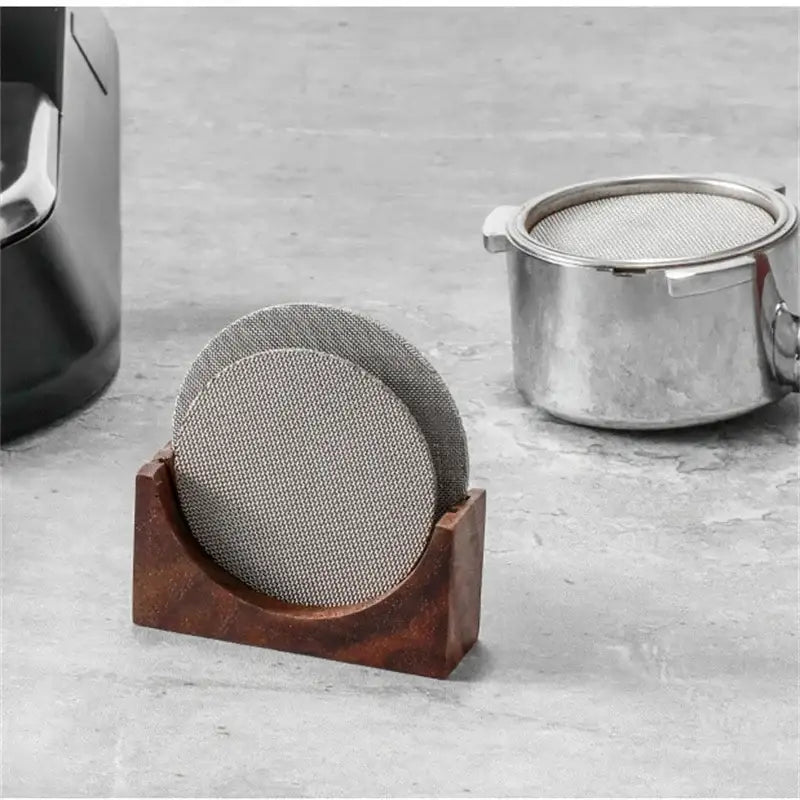 Wooden espresso filter screen holder with two gray circular metallic mesh coasters for kitchen use