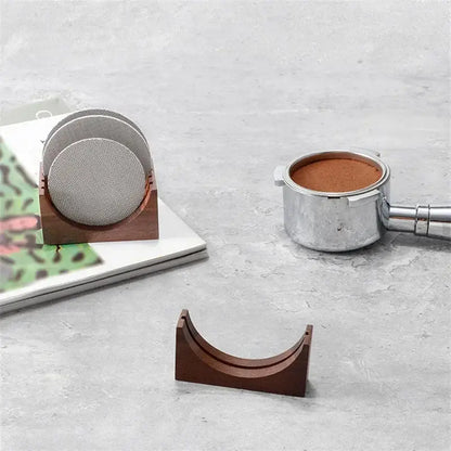 Wooden filter screen holder with three textured gray mesh coasters neatly nested in a kitchen stand