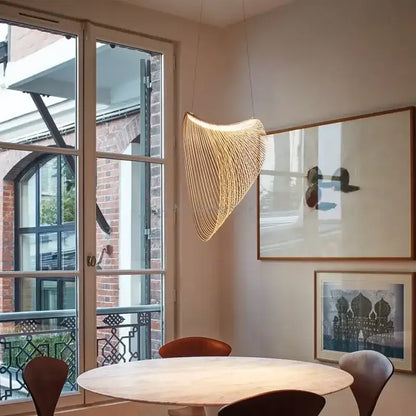 A warm golden woven birch wood led pendant lamp with fan-like metallic threads for dining room decorbites lighting