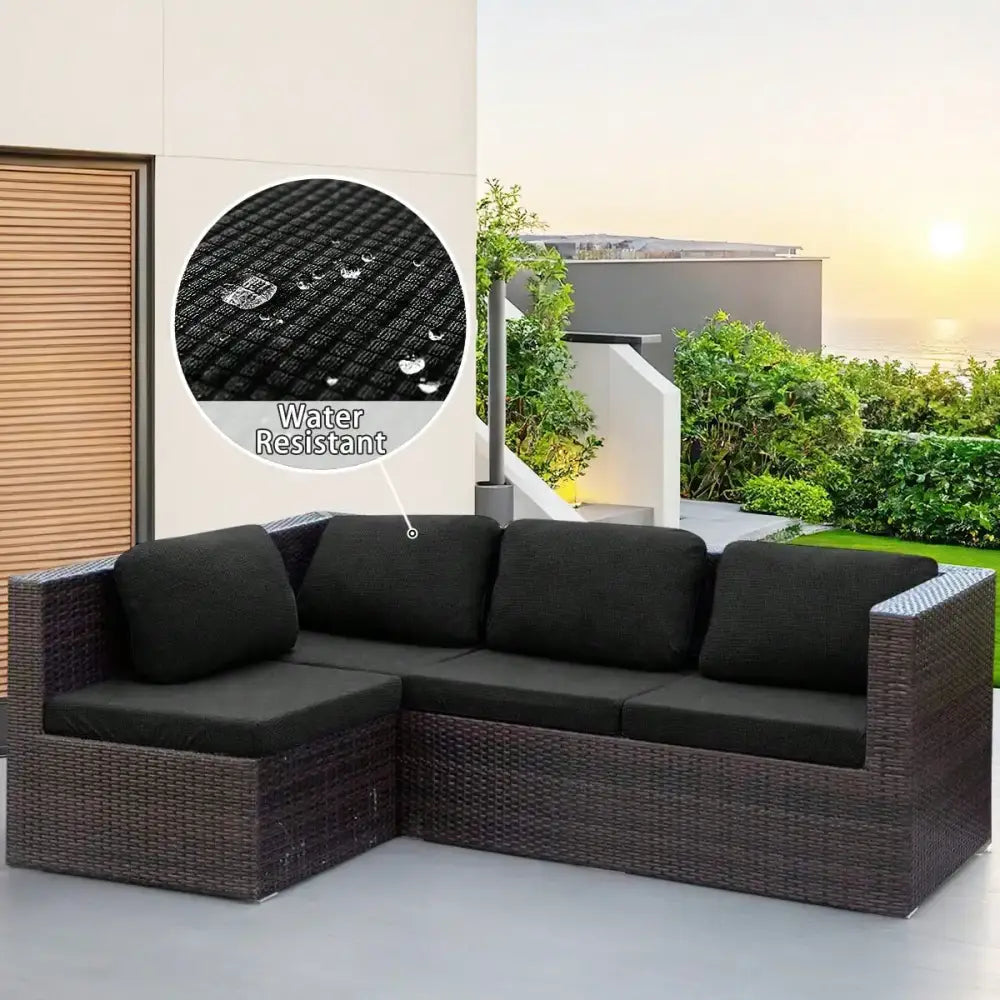 Black wicker modular sofa with brown and cream woven cover and water-resistant fabric cushions for outdoor use