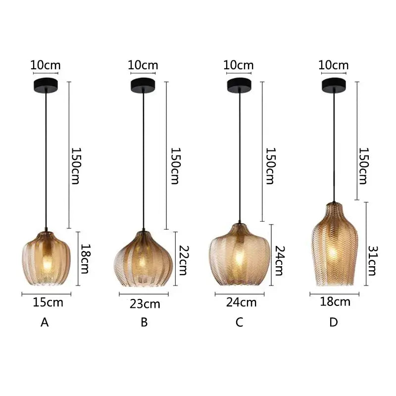 Four nordic style pendant lights with textured amber glass shades and black metal fixtures for kitchen and dining room