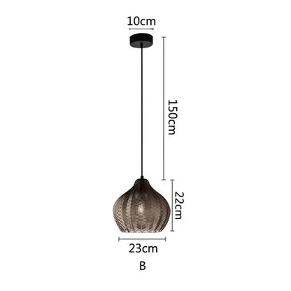 A modern black nordic style pendant light with woven textured glass shade and sleek metal chain for kitchen use
