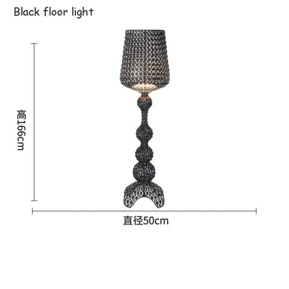 Black woven wire floor lamp with a tall sculptural base and intricate mesh shade for decorbites acrylic kabuki lighting