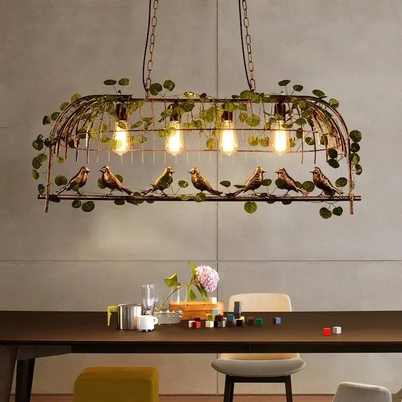 Bronze wrought iron birdcage pendant lights with green vines and exposed filament bulbs ideal for dining room decorbites birdcage pendant