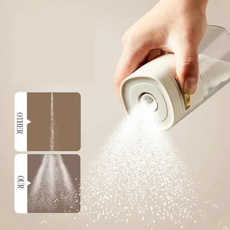 A sleek white salt grinder with gold-tone accents and a glass spice dispenser for kitchen use
