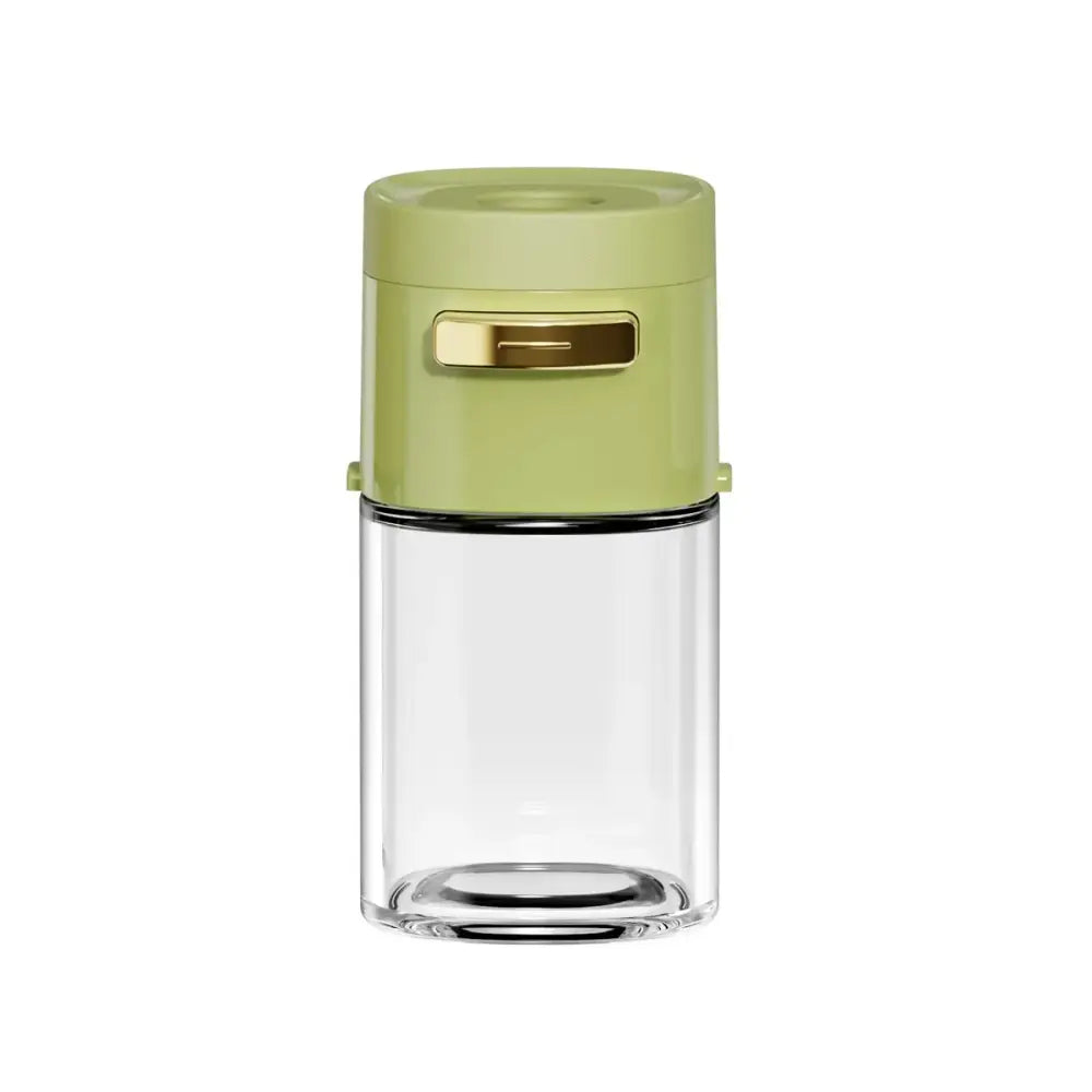 A sleek lime-green and transparent glass spice dispenser with gold-tone handle for kitchen salt grinding