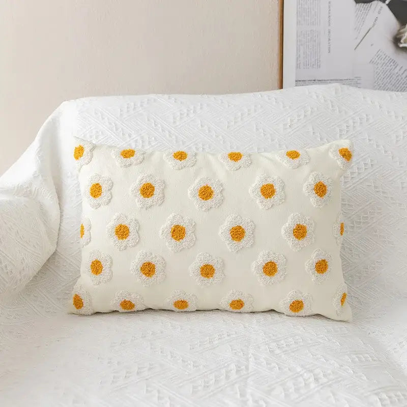 Cream-colored rectangular pillow cover with raised yellow and white daisy floral embroidery for decorbites daisy floral decor