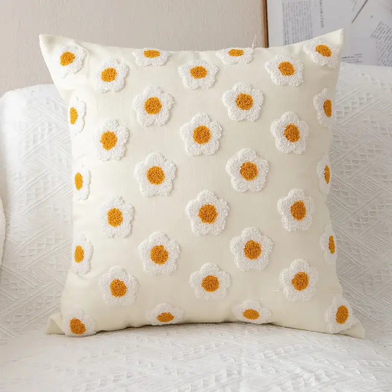 Cream-colored pillow cover with raised white and mustard-yellow daisy floral embroidery by decorbites for living room decor