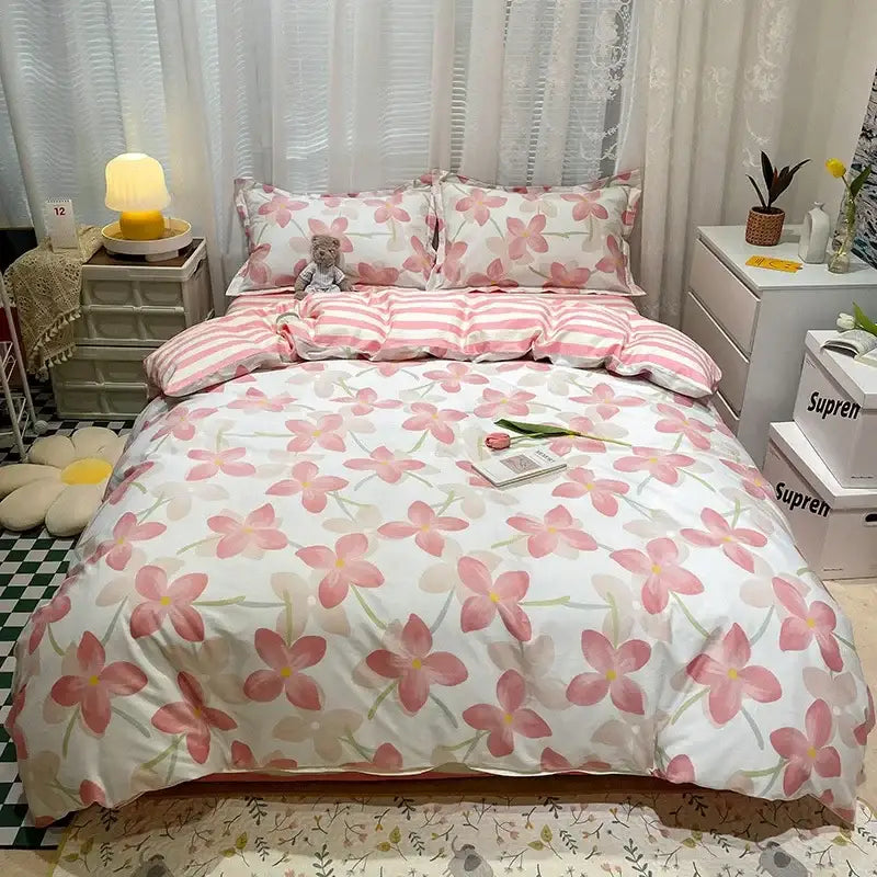Pink floral patterned bedding set with white background and striped pillowcases in decorbites flowers print cotton design