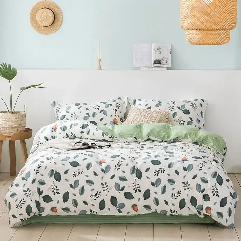 A cozy flowers print cotton bedding set with white duvet featuring green leaves and orange fruits for decorbites decor