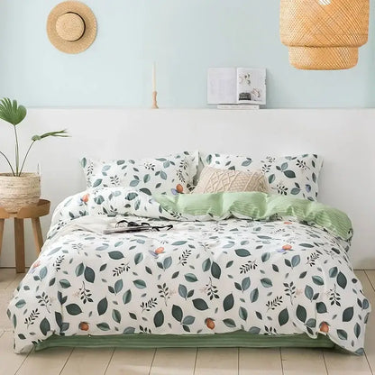 A cozy flowers print cotton bedding set with white duvet featuring green leaves and orange fruits for decorbites decor