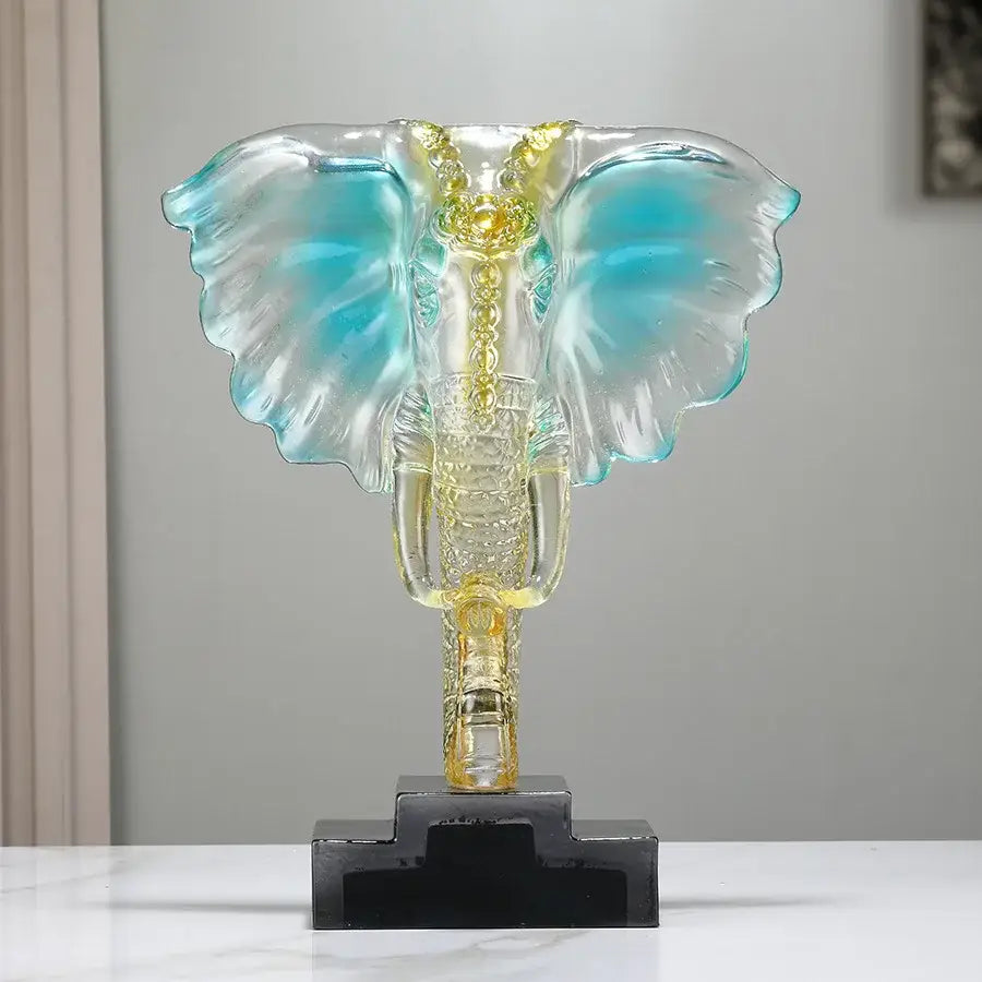 Translucent blue and gold decorbites crystal elephant sculpture on black base for elegant home decor ornament