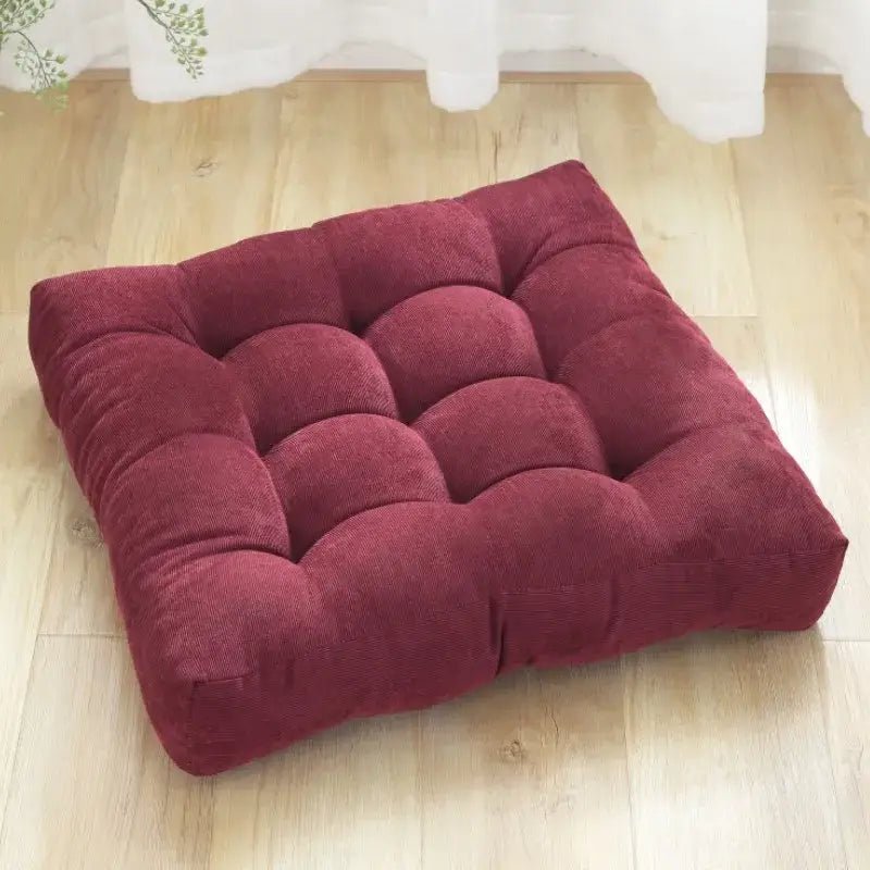 A plush deep red corduroy square floor pillow with button tufting from decorbites inyahome square cushion collection