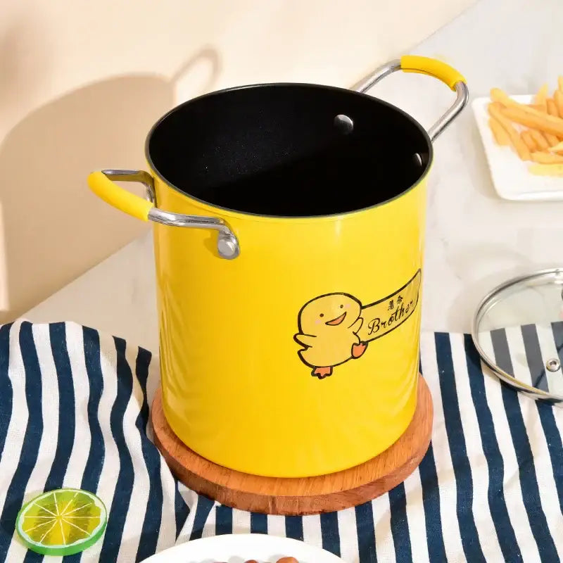 Yellow enamel deep fryer with glass lid and silver handles featuring a cartoon duck holding a brother sign by decorbites deep fryer