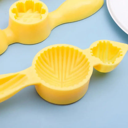 Bright yellow silicone shell shaped cookie press with detailed ridged interior for decorbites biscuit cake date pistachio molding