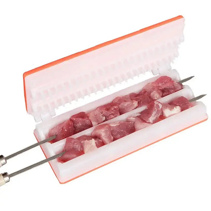 White and orange plastic meat skewer maker with pre-formed slots holding raw bbq meat on metal skewers for easy grilling
