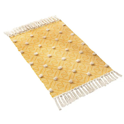 Yellow woven floor mat with geometric pattern and cream nordic 3d tassel by decorbites handmade for living room decor