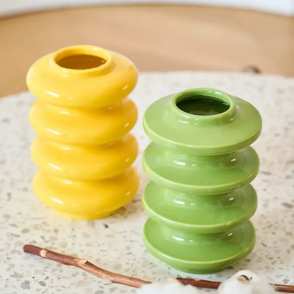 Vibrant yellow and green ceramic vase with geometric circles abstract stacked tiers for living room decorbites geometric circles